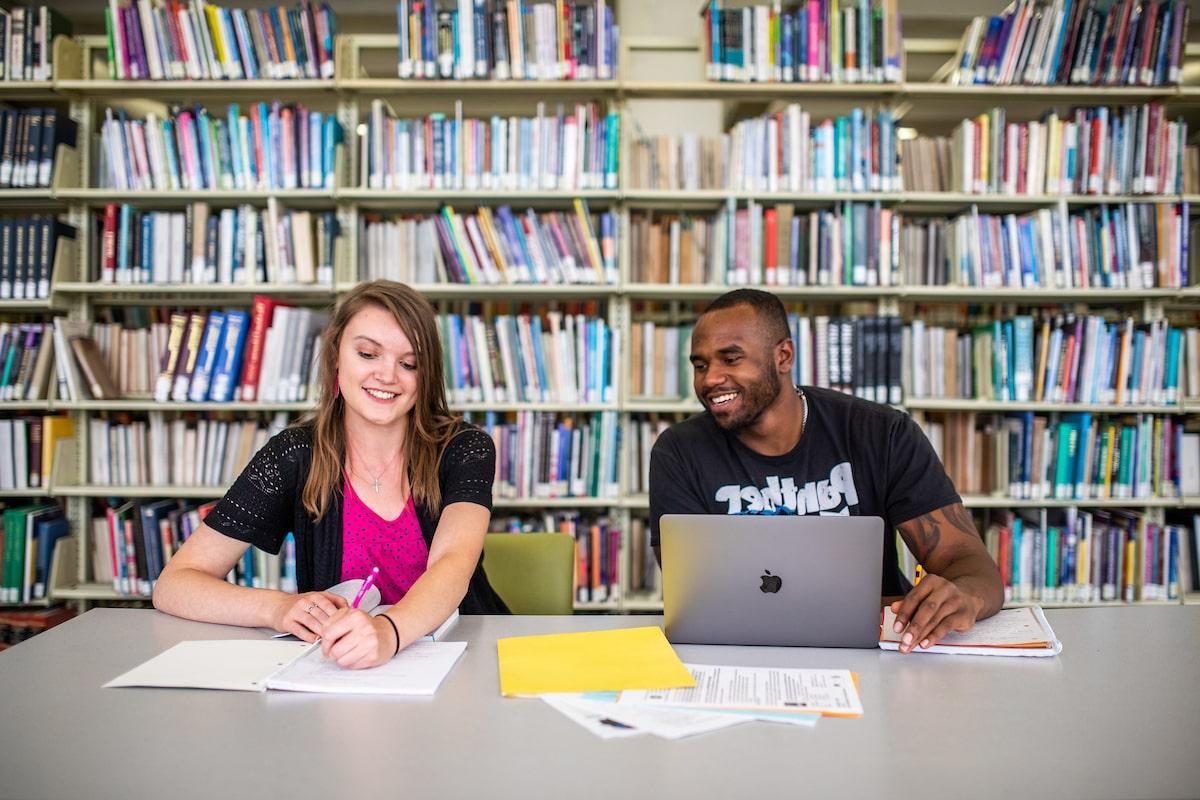 Students share a study space in the Auraria Library.